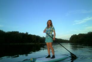 Paddler on calm river